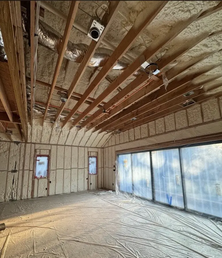 Interior walls and ceiling insulated with spray foam during new construction in Bradford